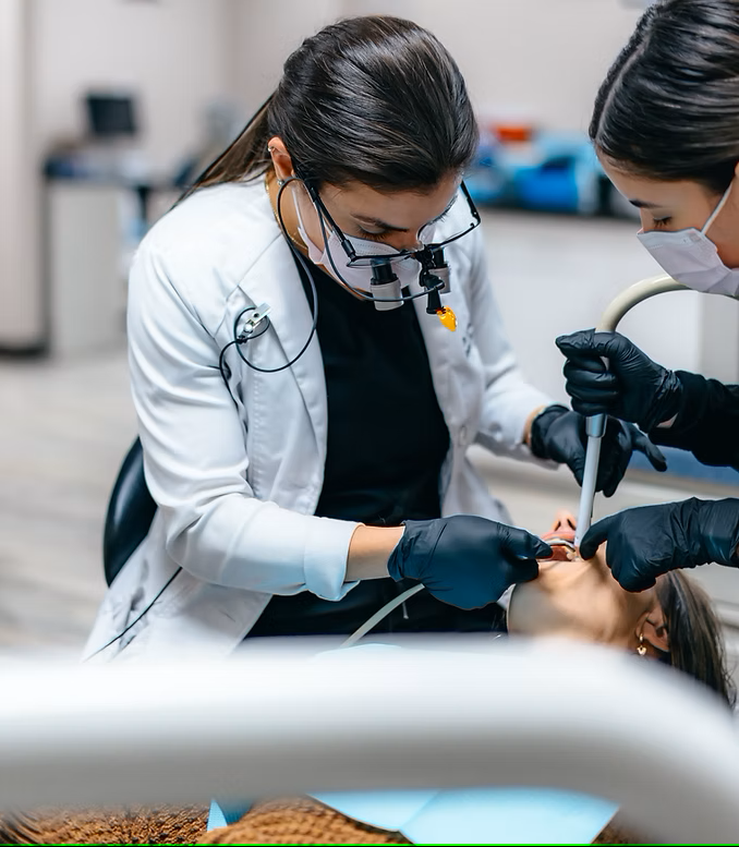 Dr. Revan Dawood and the Glisten Dental team performing precision dental work